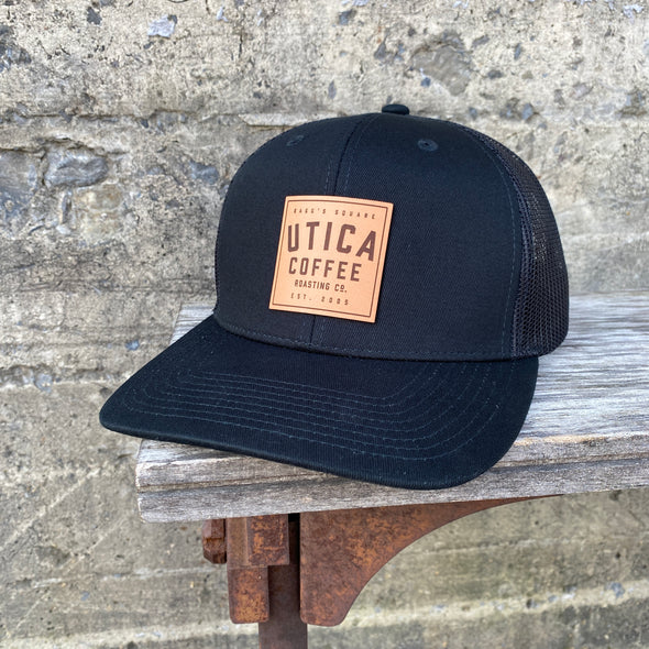 Utica Coffee Leather Patch Black Trucker Hat